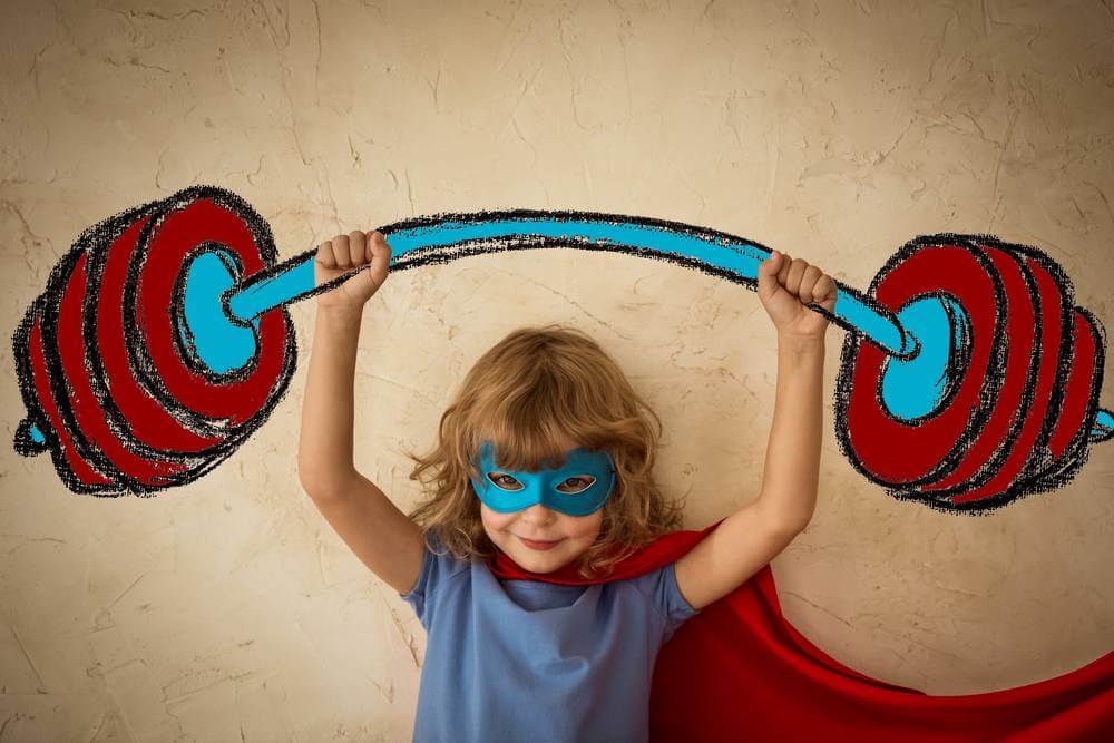 A beautiful image of a young girl feeling strong via Straight.com from an article about young girls influenced by media.