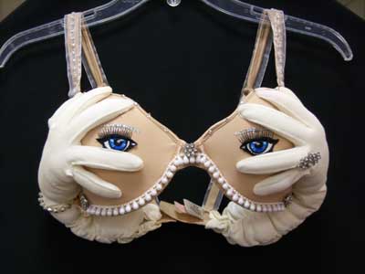 Bra with eyes peeking out of fingers